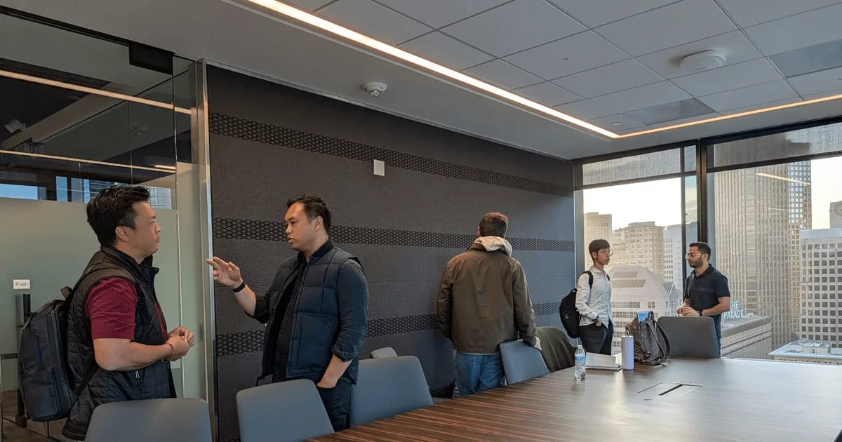FounderNexus members talking in small groups after a speaker event